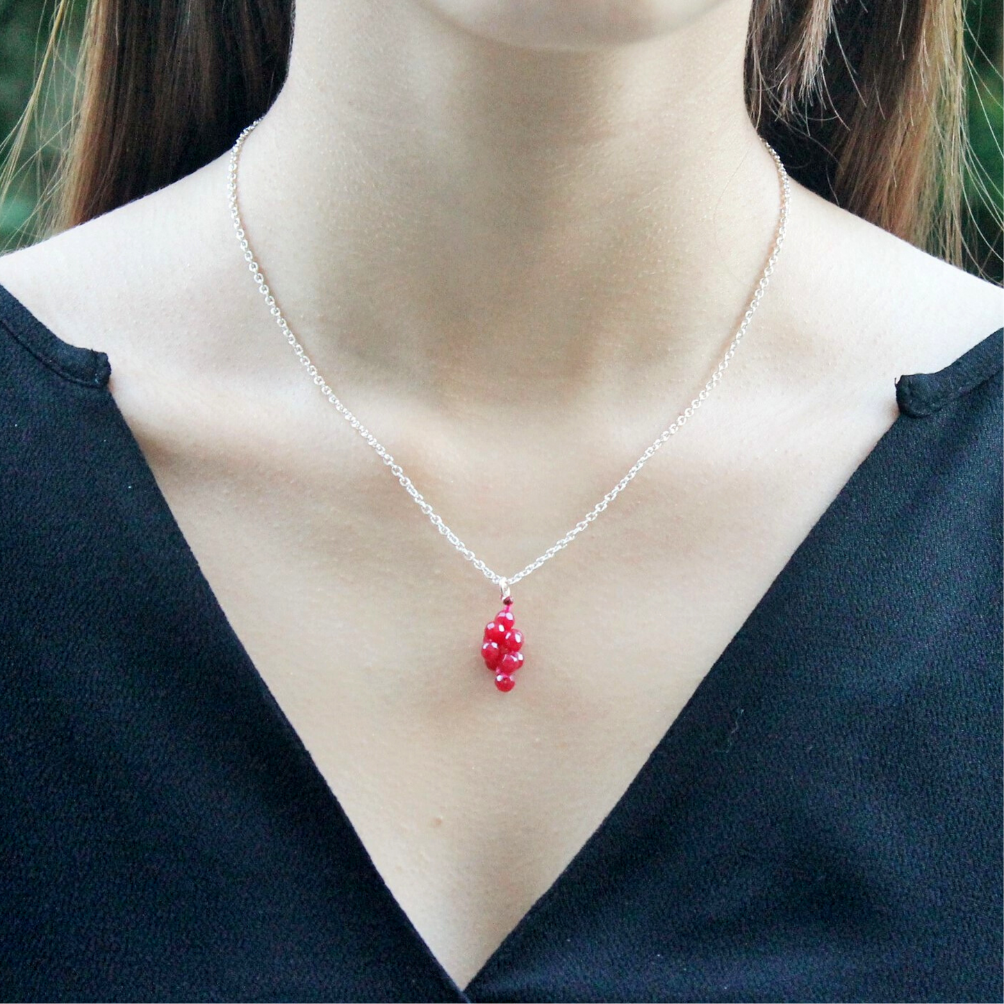 Ruby pendant and silver chain necklace