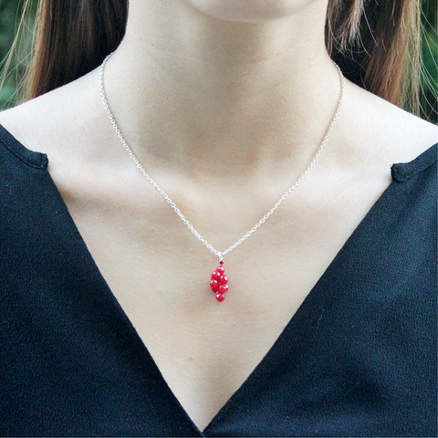 Ruby pendant and silver chain necklace