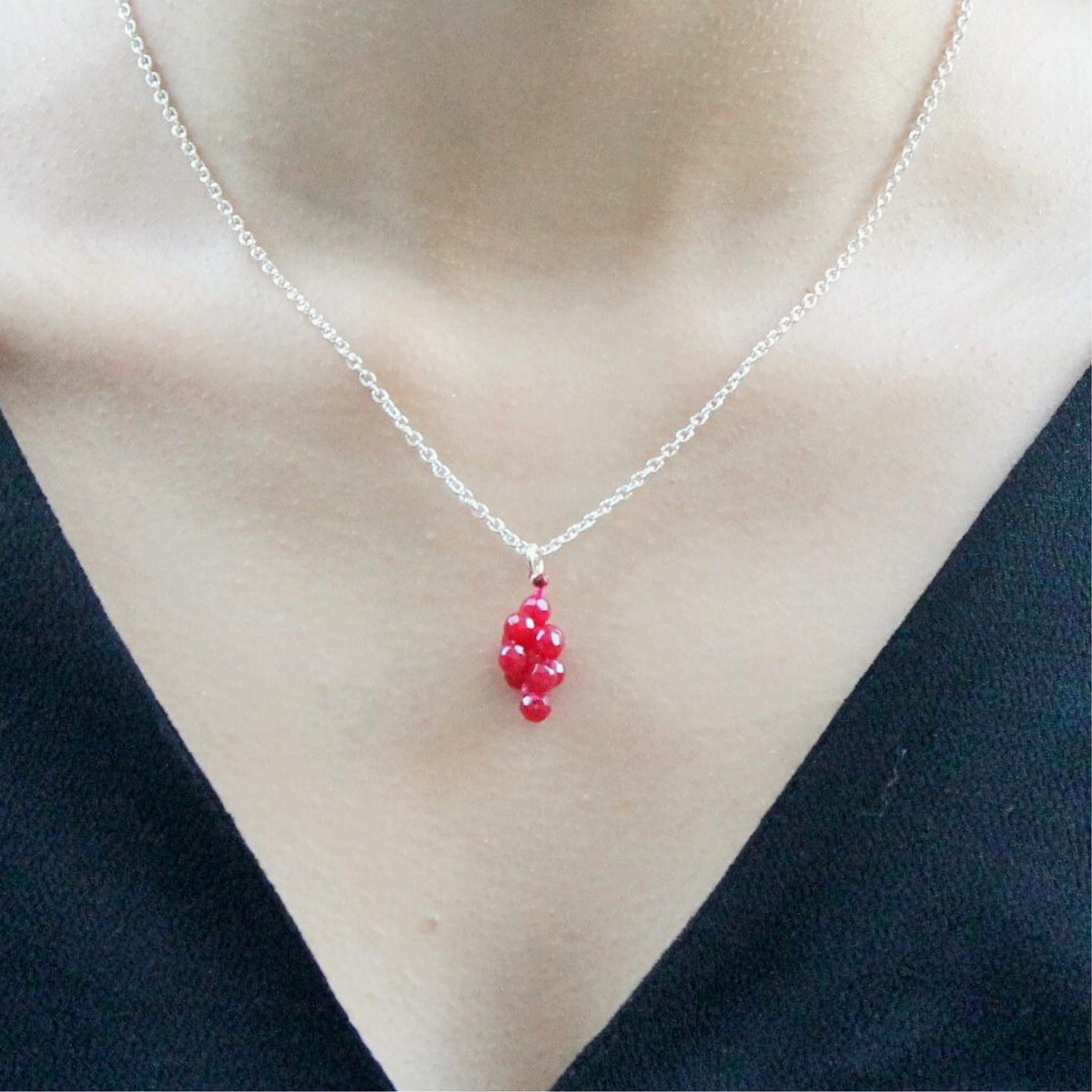 Ruby pendant and silver chain necklace