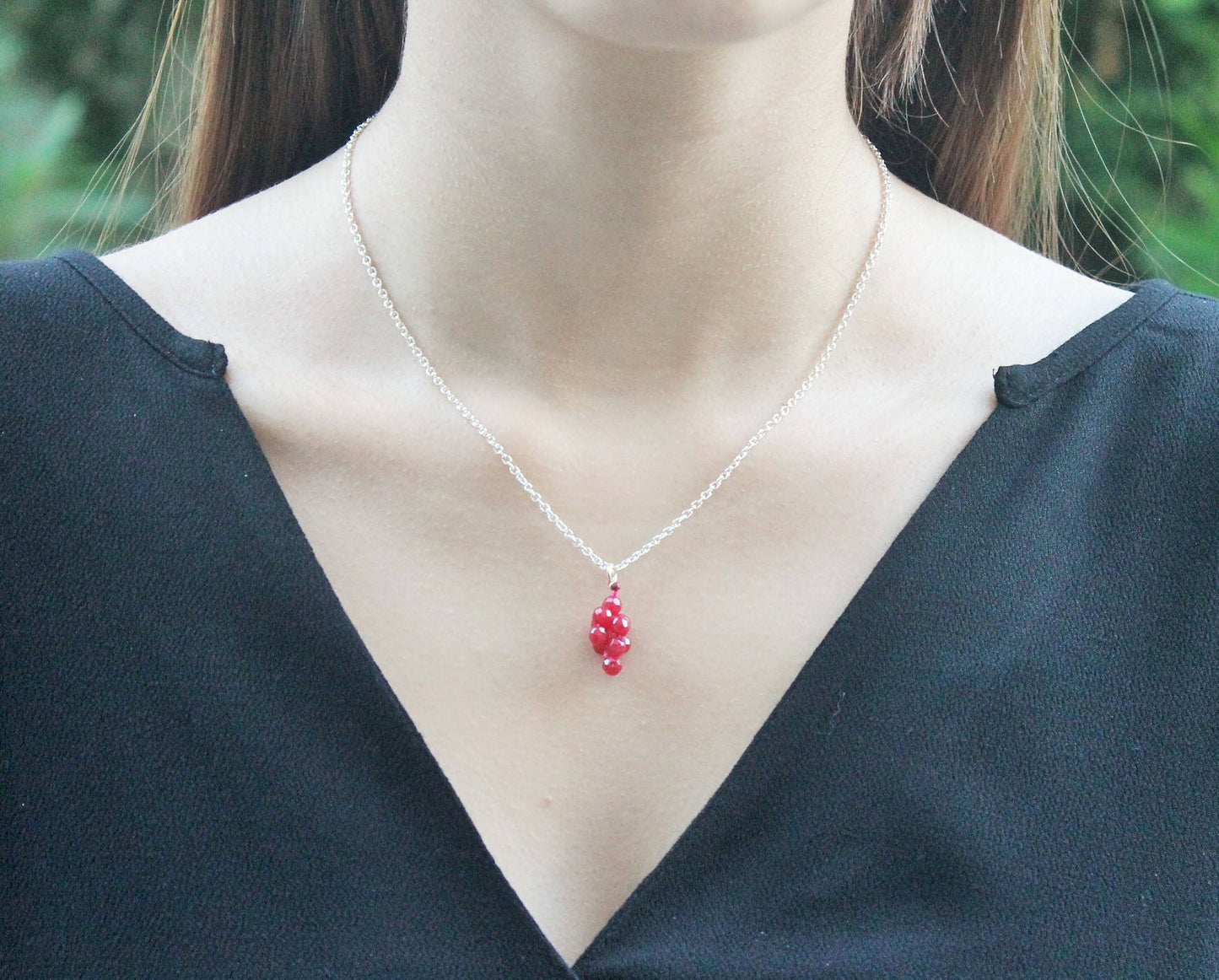 Ruby pendant and silver chain necklace